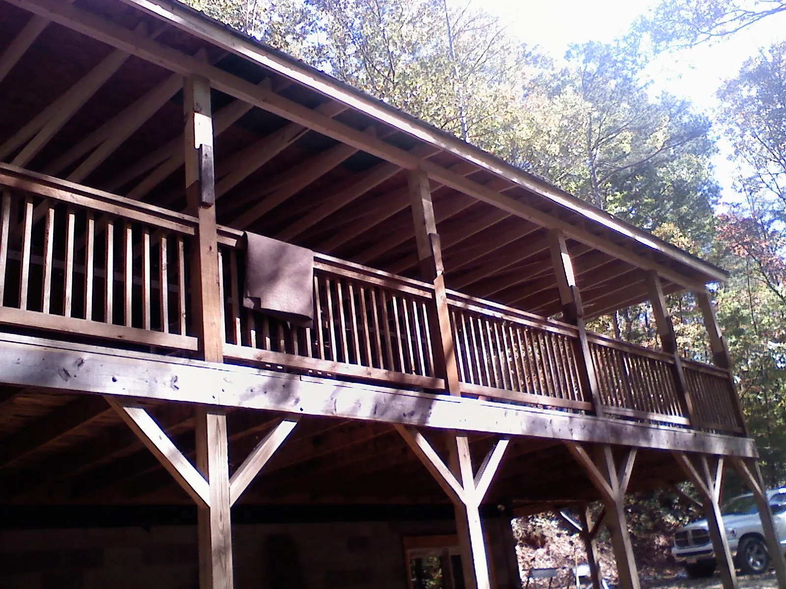 Timber framing under a new elevated porch and deck — Roof Leak Repair in Newton Center by Roofing Brothers